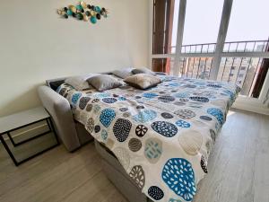 מיטה או מיטות בחדר ב-APPART HOTEL DU BOIS DE VINCENNES
