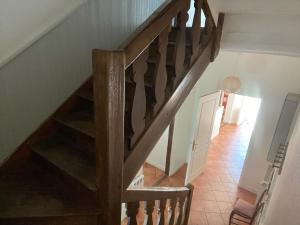 an overhead view of a wooden staircase in a house at gite de lambilly in Taupont