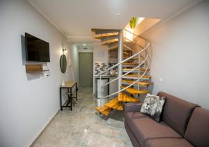 TV a/nebo společenská místnost v ubytování Artemida Suites