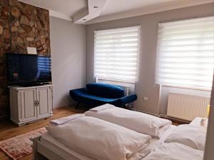 Posteľ alebo postele v izbe v ubytovaní Hürrem Apartman