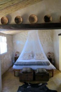 En eller flere senge i et værelse på Zeekoegat Country House BñB