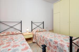 Posteľ alebo postele v izbe v ubytovaní Villetta Bifamiliare 2 + 17 fotografií
