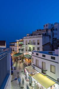 a view of a city street at night at Hotel Baltum in Albufeira