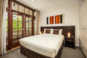 Ein Bett oder Betten in einem Zimmer der Unterkunft Quest Canberra