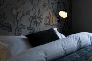 Rúm í herbergi á Hotel Siglunes