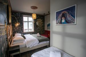 Rúm í herbergi á Hotel Siglunes