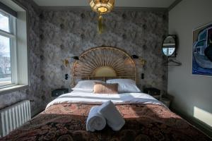 Rúm í herbergi á Hotel Siglunes