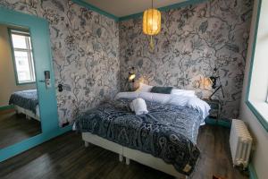 Rúm í herbergi á Hotel Siglunes