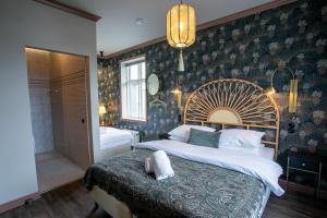 Rúm í herbergi á Hotel Siglunes