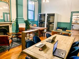a room with a table with a laptop on it at Roamer St Kilda - formerly Selina St Kilda Melbourne in Melbourne