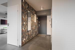a hallway with a wall mural of animals at Dom nad Jeziorem - Perfect Stay in Tomaszkowo