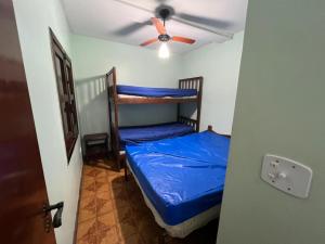 Ένα ή περισσότερα κρεβάτια σε δωμάτιο στο Condomínio - Praia Grande - Ubatuba/SP