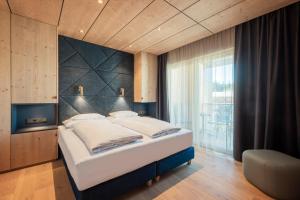 Ένα ή περισσότερα κρεβάτια σε δωμάτιο στο Hotel Kristall - Adults only