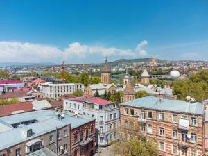 an aerial view of a city with buildings at Sharden Hotel in Tbilisi City