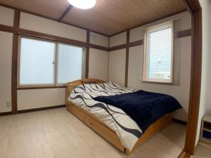 Voodi või voodid majutusasutuse Nagayama Home toas