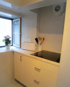 Kuchyň nebo kuchyňský kout v ubytování Shabby Chic Bairro Alto