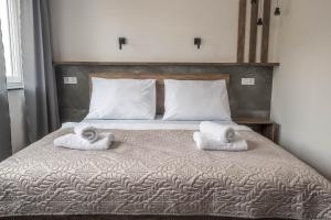 Posteľ alebo postele v izbe v ubytovaní Veltlin Bed & Wine