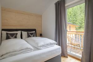 Postel nebo postele na pokoji v ubytování Luxalps- Turrach Alm Chalets Nr 1-4 Grünsee- Sauna- Skifahren- Wandern- Natur