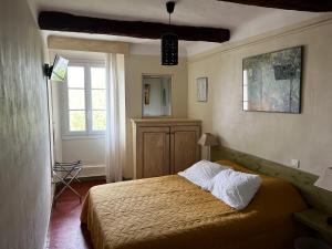 Кровать или кровати в номере Le Vieux Château