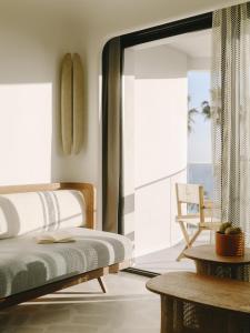 a bedroom with a bed and a view of the ocean at Hôtel & Spa Belle Plage in Cannes