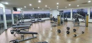 a gym with treadmills and machines in a building at Swiss Garden Resort Residence, studio, sea & pool view, high level unit in Kuantan