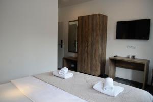 Posteľ alebo postele v izbe v ubytovaní Veltlin Bed & Wine