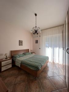 سرير أو أسرّة في غرفة في Casa Vacanze a Fondachello di Mascali, a due passi dal mare