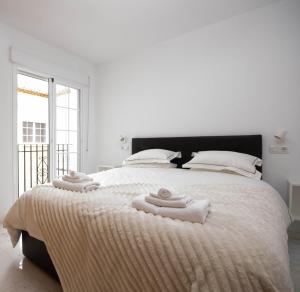 Кровать или кровати в номере Luxury Penthouse: The Beacon at Punta de la Mona