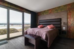 Postel nebo postele na pokoji v ubytování Hotel Kriunes