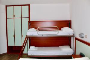 Postel nebo postele na pokoji v ubytování Hotel Cristina