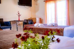 Ένα ή περισσότερα κρεβάτια σε δωμάτιο στο Imperial Home Tsironis