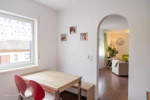 a dining room with a table and chairs and a mirror at Casa Katharina in Wald-Michelbach