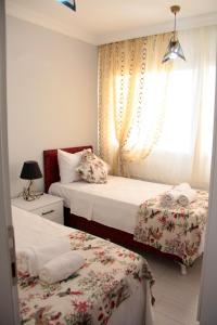 Postel nebo postele na pokoji v ubytování küçük villa