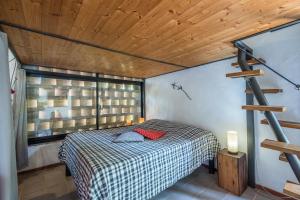 Katil atau katil-katil dalam bilik di Monolocale Antico Fienile