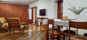 a living room with a table and chairs at La casa del Norte in Humahuaca