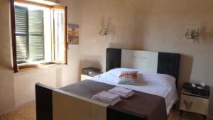 Vuode tai vuoteita majoituspaikassa Il Vicoletto di BIBI - B&B
