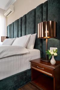 Postel nebo postele na pokoji v ubytování Greguar Hotel by UHM