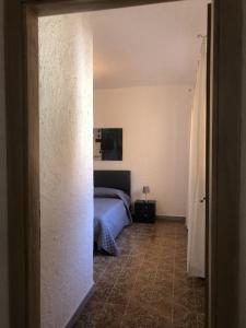 Posteľ alebo postele v izbe v ubytovaní Villa nel centro di Palau