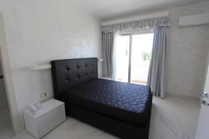 Postel nebo postele na pokoji v ubytování Hotel Presidente