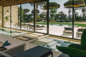 a view of a patio with a view of the ocean at Hotel Camiral at PGA Catalunya in Caldes de Malavella