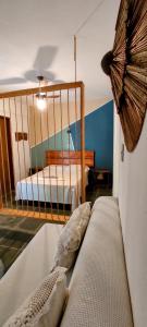 Ένα ή περισσότερα κρεβάτια σε δωμάτιο στο O Caramuru Hostel - Cumuruxatiba