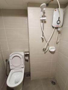 a small bathroom with a toilet and a shower at PINNACLE KELANA JAYA in Petaling Jaya