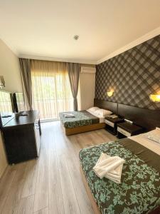Postel nebo postele na pokoji v ubytování CASTLE PARK HOTEL