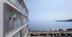 a building with windows with a view of the ocean at RVHotels Nieves Mar in L'Escala