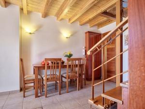 a kitchen and dining room with a table and chairs at Petreas Castle in Kardamyli