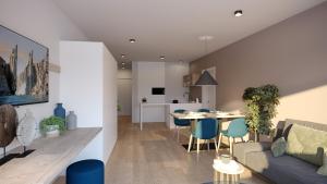 a living room and kitchen with a couch and a table at Villa Kranebitt in Bressanone