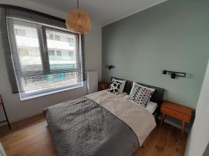 Cama ou camas em um quarto em Bohema Praga Apartments, Metro Szwedzka, near Old Town