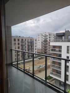 a balcony with a view of a city at Apartament Chrobrego in Gdańsk