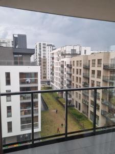 a view from the balcony of a building with buildings at Apartament Chrobrego in Gdańsk