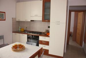Кухня или мини-кухня в CasaPescoluse
